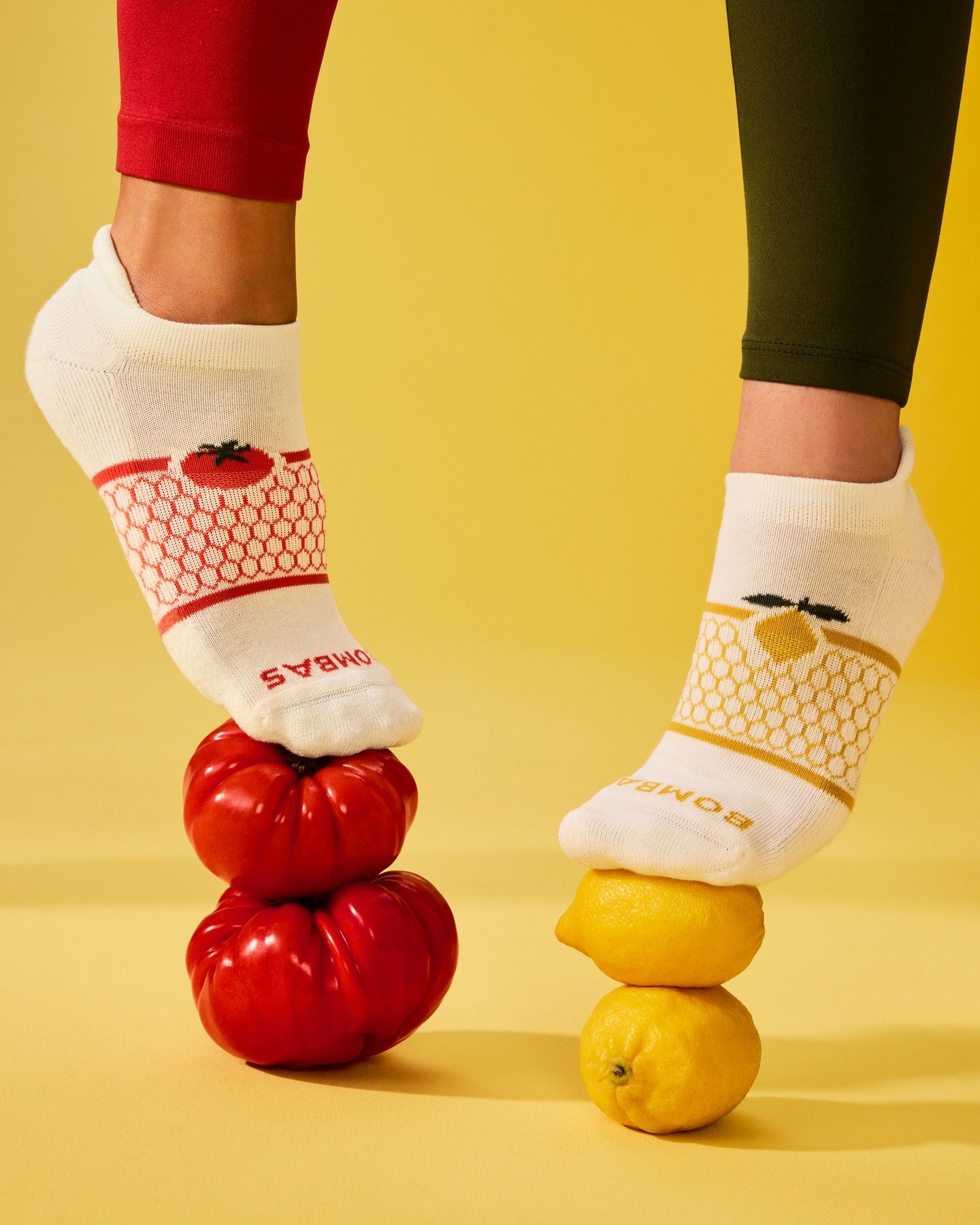 Instagram post: Socks balance playfully on colorful fruit