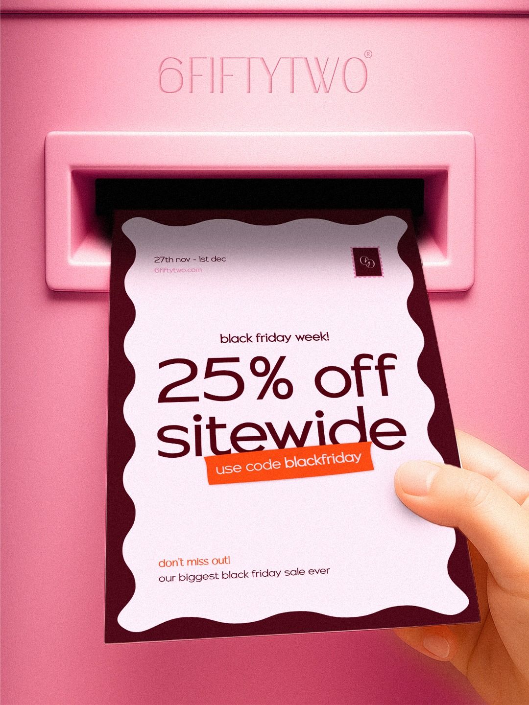 Hand pulling a sale flyer out of a pink mail slot