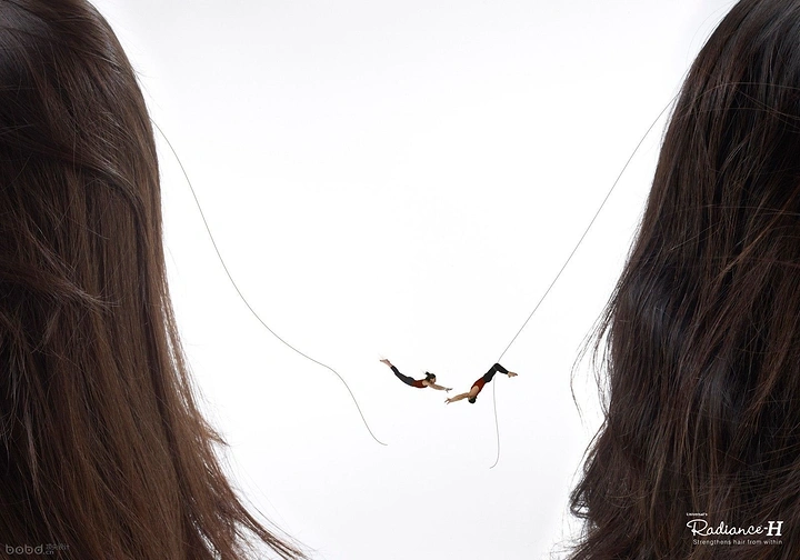 Hair Transplant & Hair Clinics creative ad: Tiny acrobat on hair strand