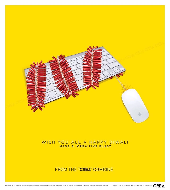 Diwali creative ad: Keyboard covered in red cracker strings with a mouse as the lit fuse