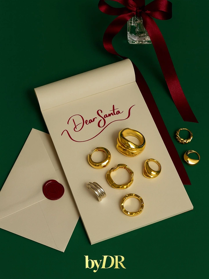 Christmas creative ad: Gold rings arranged on a cream notepad wish letter