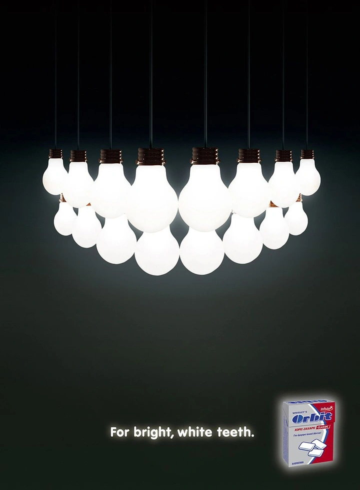 Toothpaste & Oral Care creative ad: Lightbulbs arranged as glowing smile