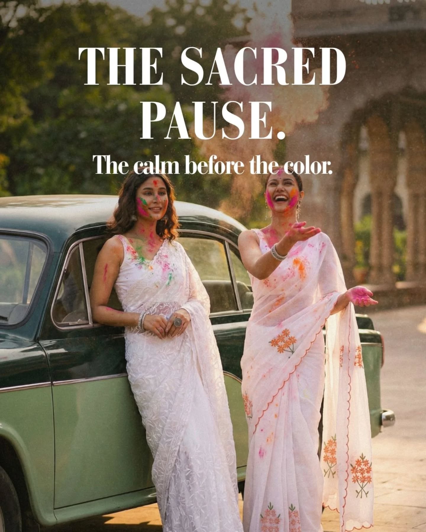 Holi Carousel: Two women in white embroidered sarees with Holi colour beside a vintage green car, slide 1