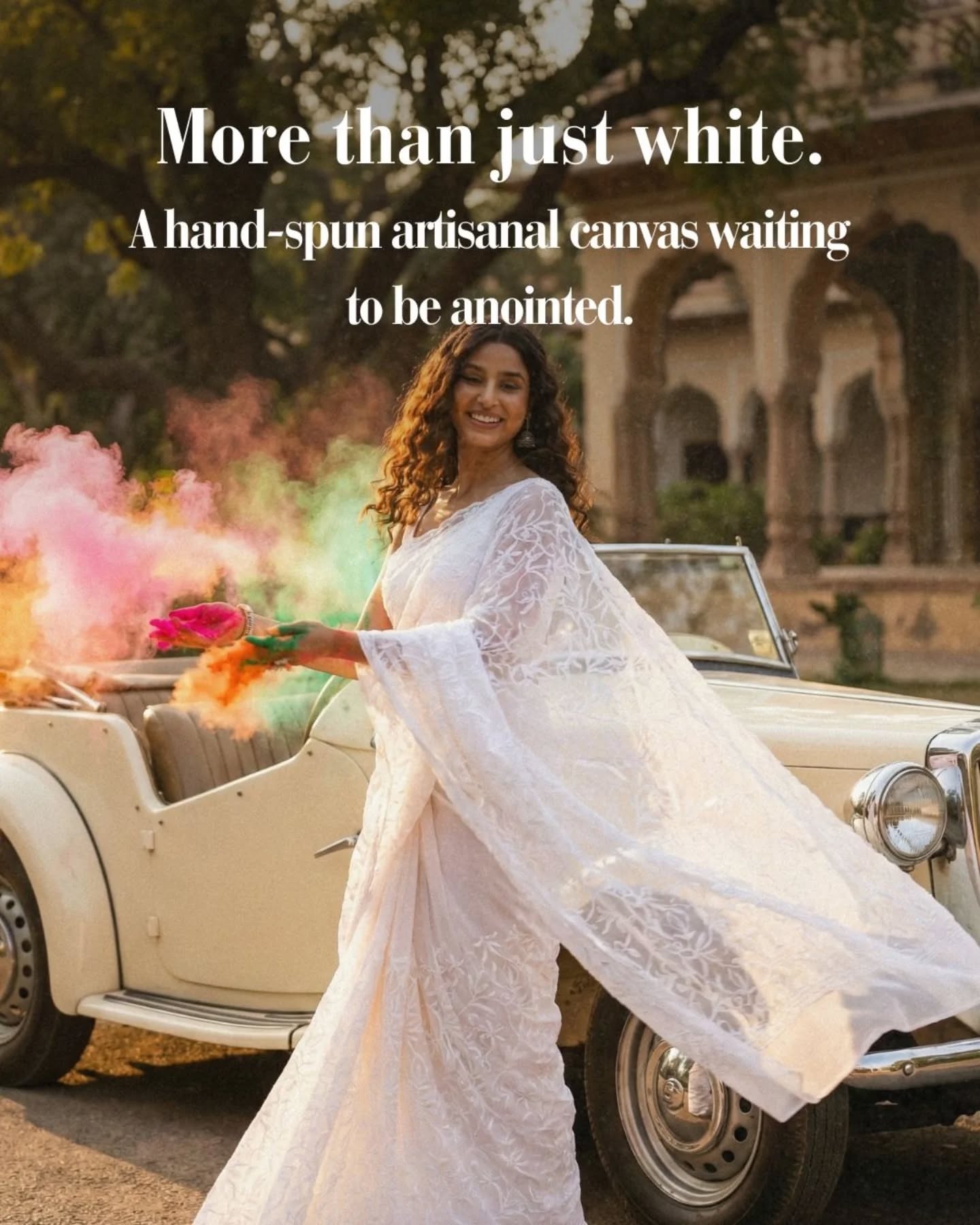 Holi Carousel: Two women in white embroidered sarees with Holi colour beside a vintage green car, slide 3