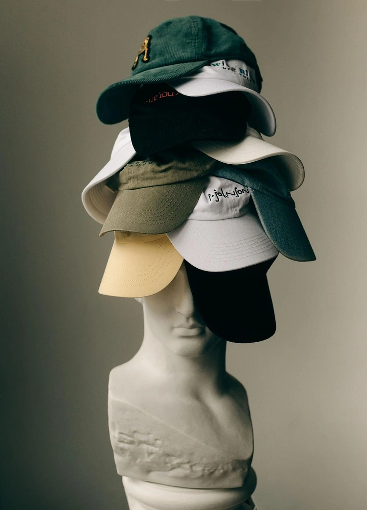 Hats & Caps creative ad: Sculptural hat stack creates memorable silhouette