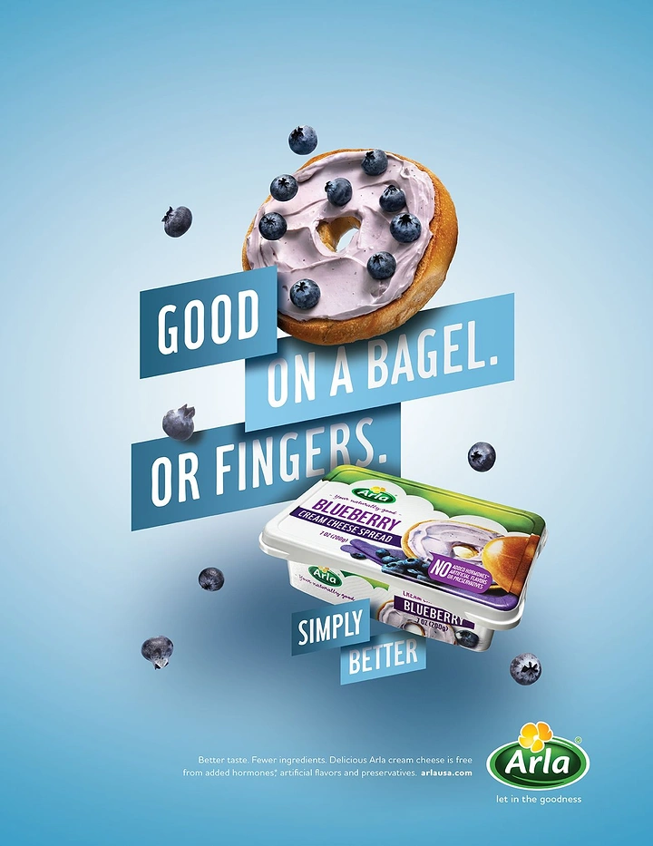 Creative ad: Floating bagel with blueberry cream cheese above the product tub