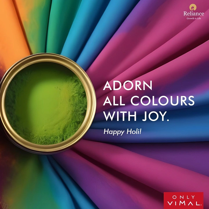 Holi creative ad: Brass bowl of green gulal amid radiating rainbow fabric folds
