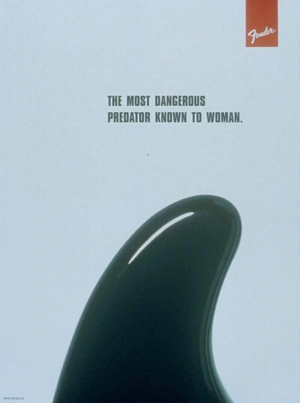 Musical Instrument Stores creative ad: Glossy black guitar headstock shaped like a shark fin