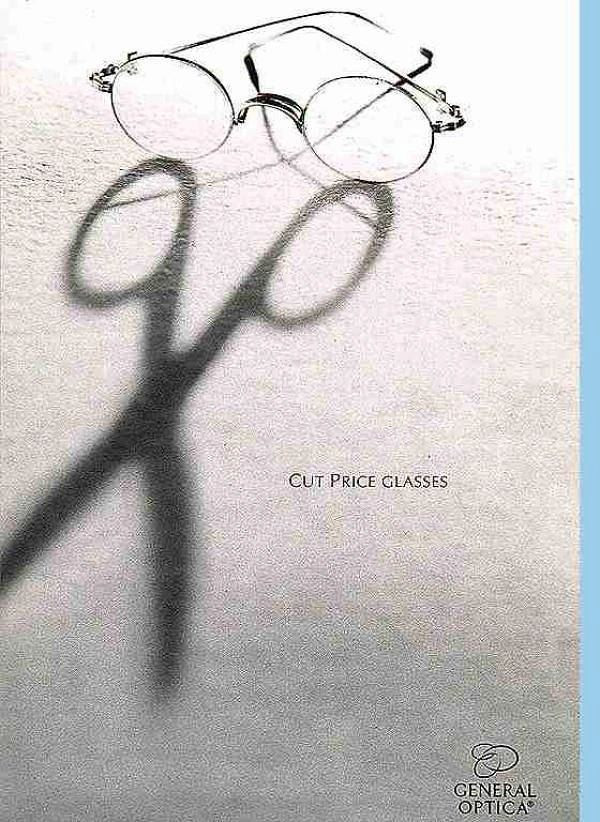 Opticians & Eye Care creative ad: Open wire-rim glasses casting a shadow shaped like scissors