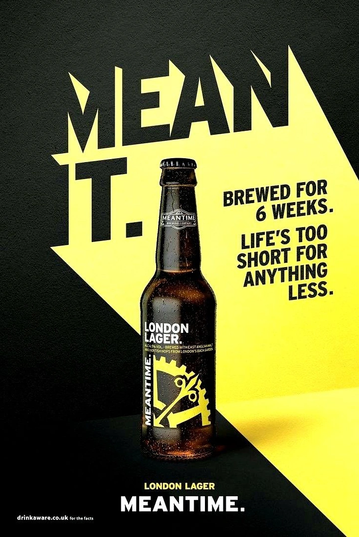 Creative ad: Brown lager bottle in a yellow light beam