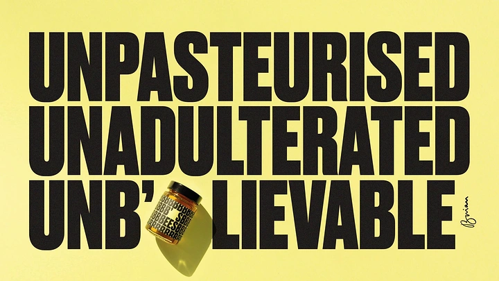 Honey Brands creative ad: Small honey jar standing in for the letter E in a huge type headline