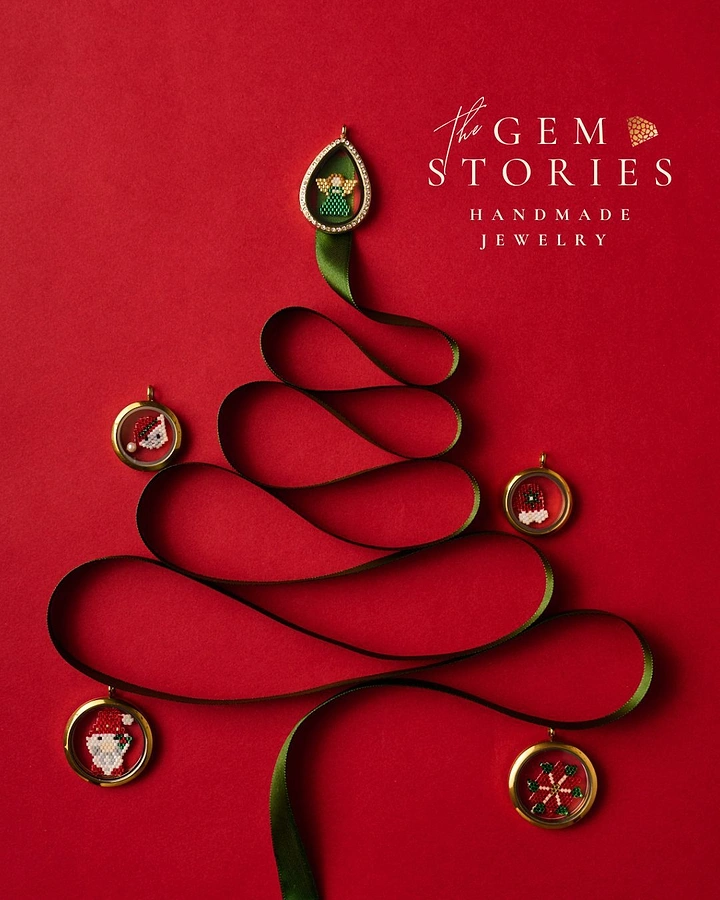 Christmas creative ad: Green satin ribbon looped into a Christmas tree with gold beaded lockets as ornaments