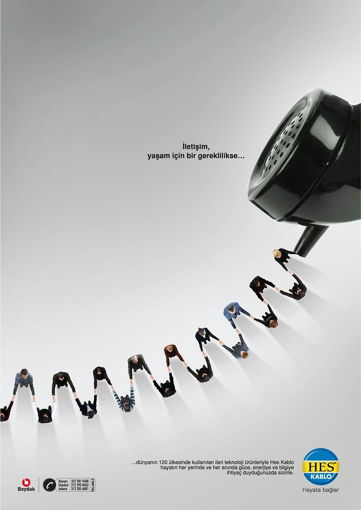 Telecom creative ad: Line of people holding hands, forming a coiled phone cord that runs to a black handset