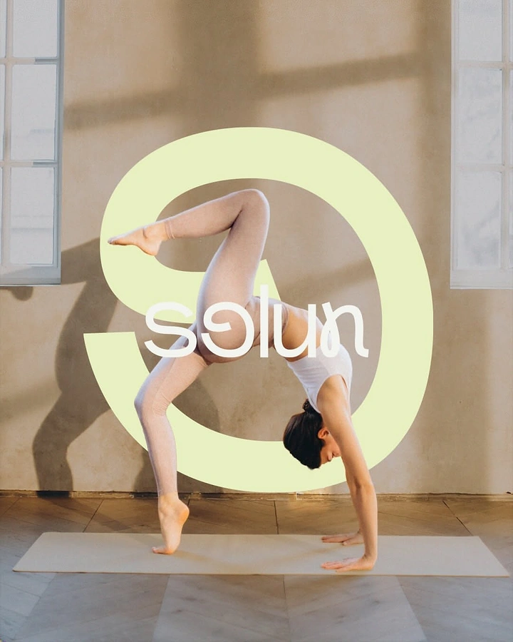 Yoga Studios creative ad: Backbend pose echoes curved brand logo