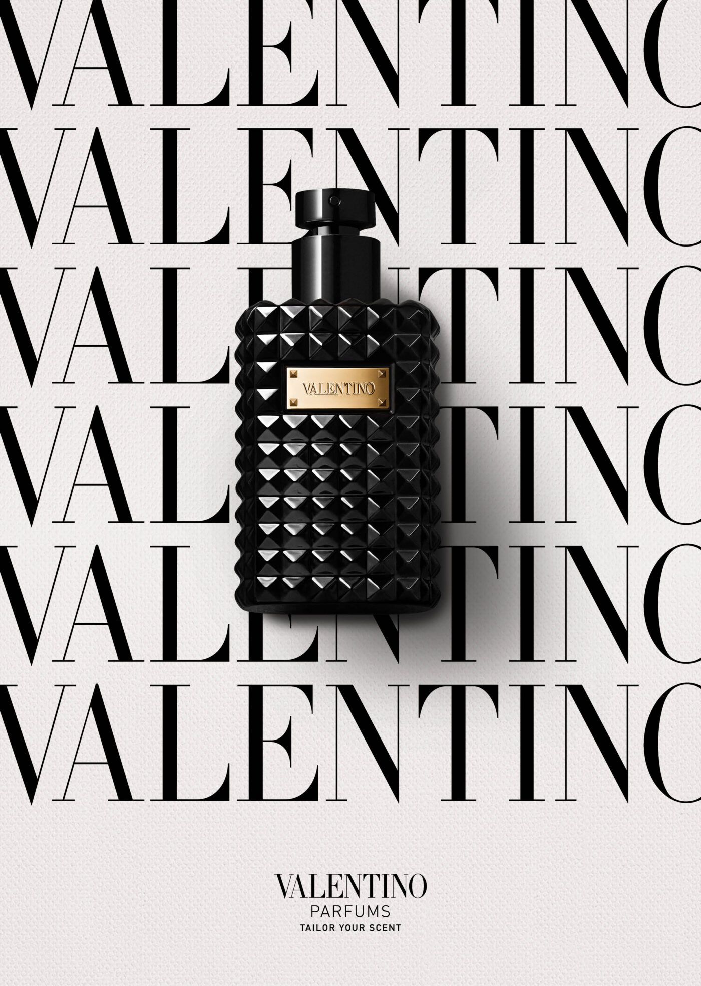 Poster: Black studded perfume bottle on repeated wordmark