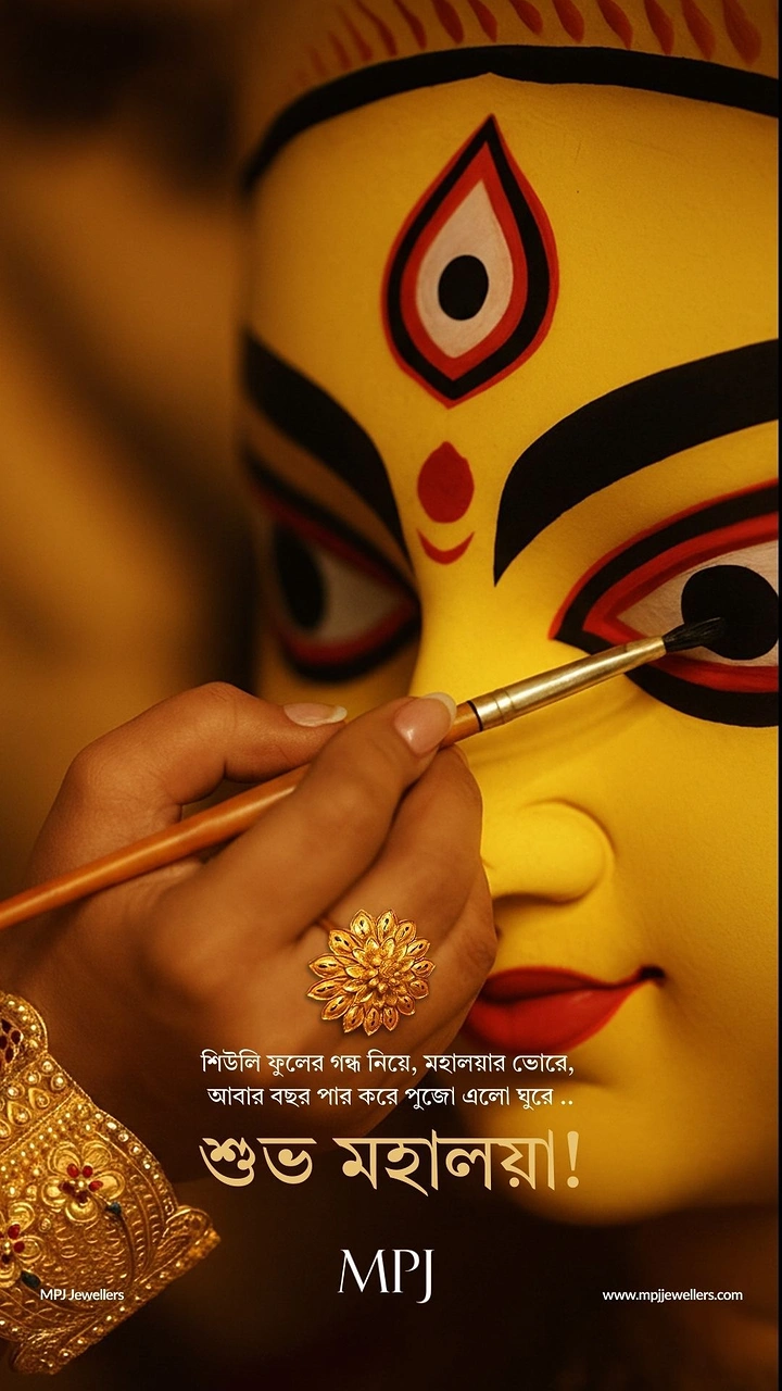 Durga Puja creative ad: Hand wearing gold jewellery painting the eye of a Durga idol