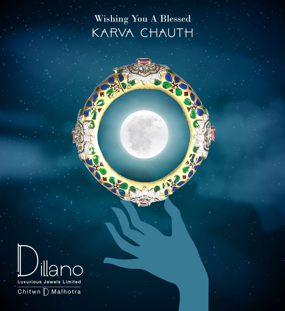 Meenakari bangle framing the full moon, held by a silhouette hand