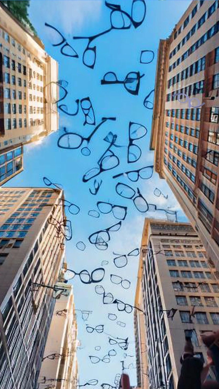 Opticians & Eye Care creative ad: Glasses flock like birds between buildings