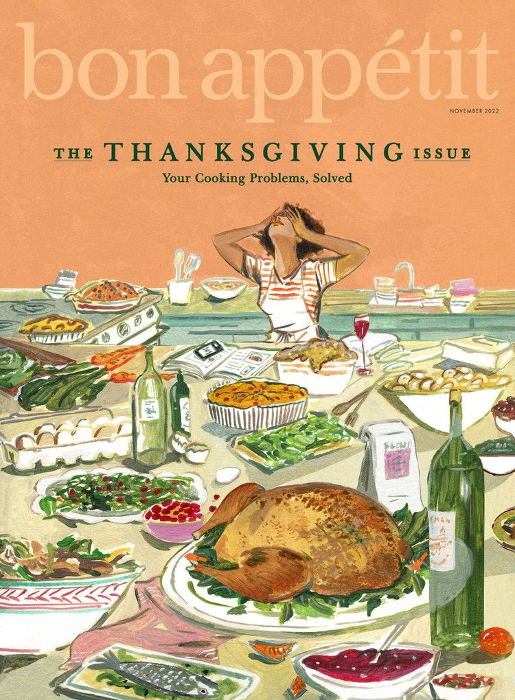 Overwhelmed cook behind a crowded Thanksgiving feast table