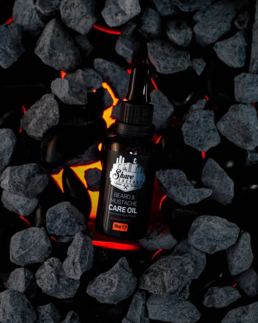 Instagram post: Black beard oil bottle nestled among glowing lava rocks