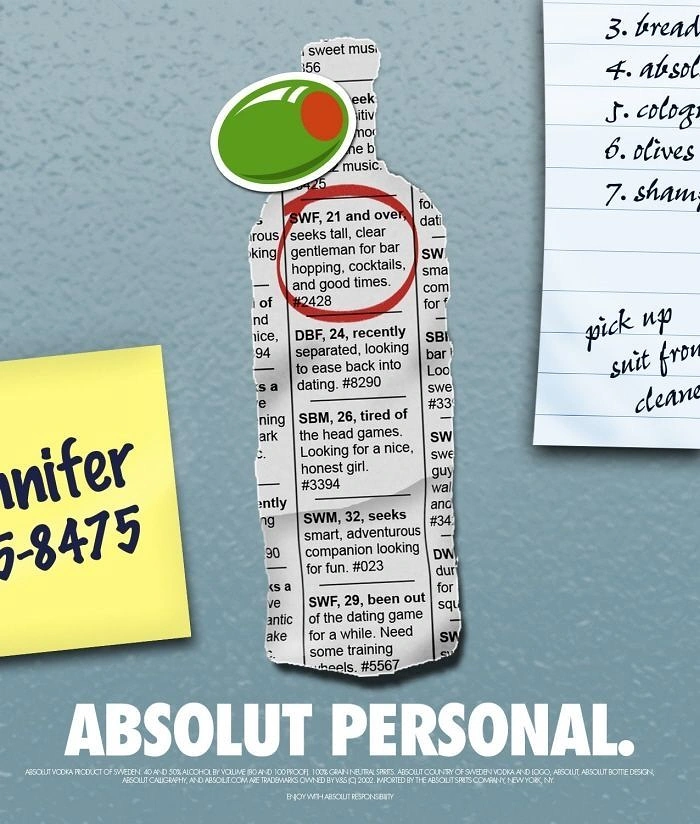 Creative ad: Bottle silhouette torn from newspaper personal ads, pinned to a wall