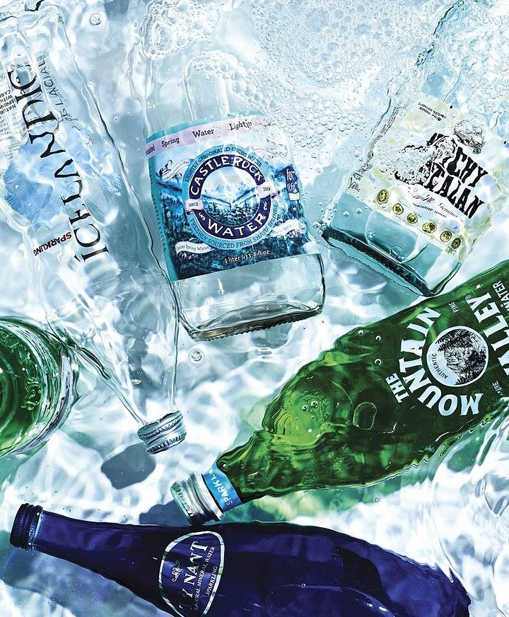 Packaged Drinking Water creative ad: Dynamic multi-bottle splash collage idea