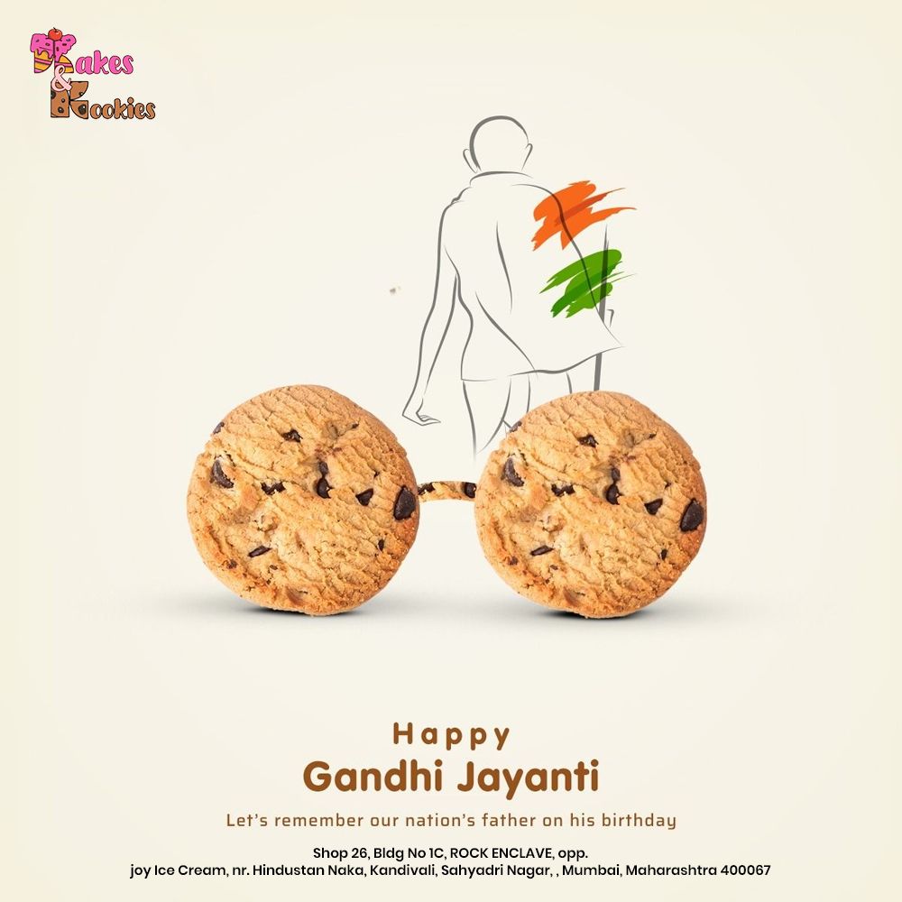 Two chocolate-chip cookies forming Gandhi's round spectacles below a line-art Gandhi