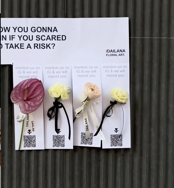 Florists creative ad: Real flowers as tear-off poster tabs