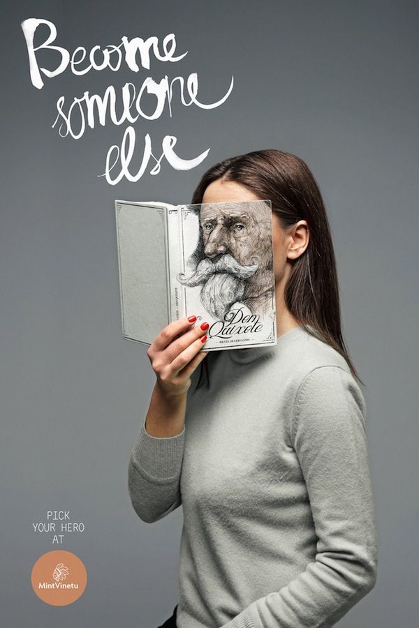 Woman holding a book whose cover portrait replaces her face