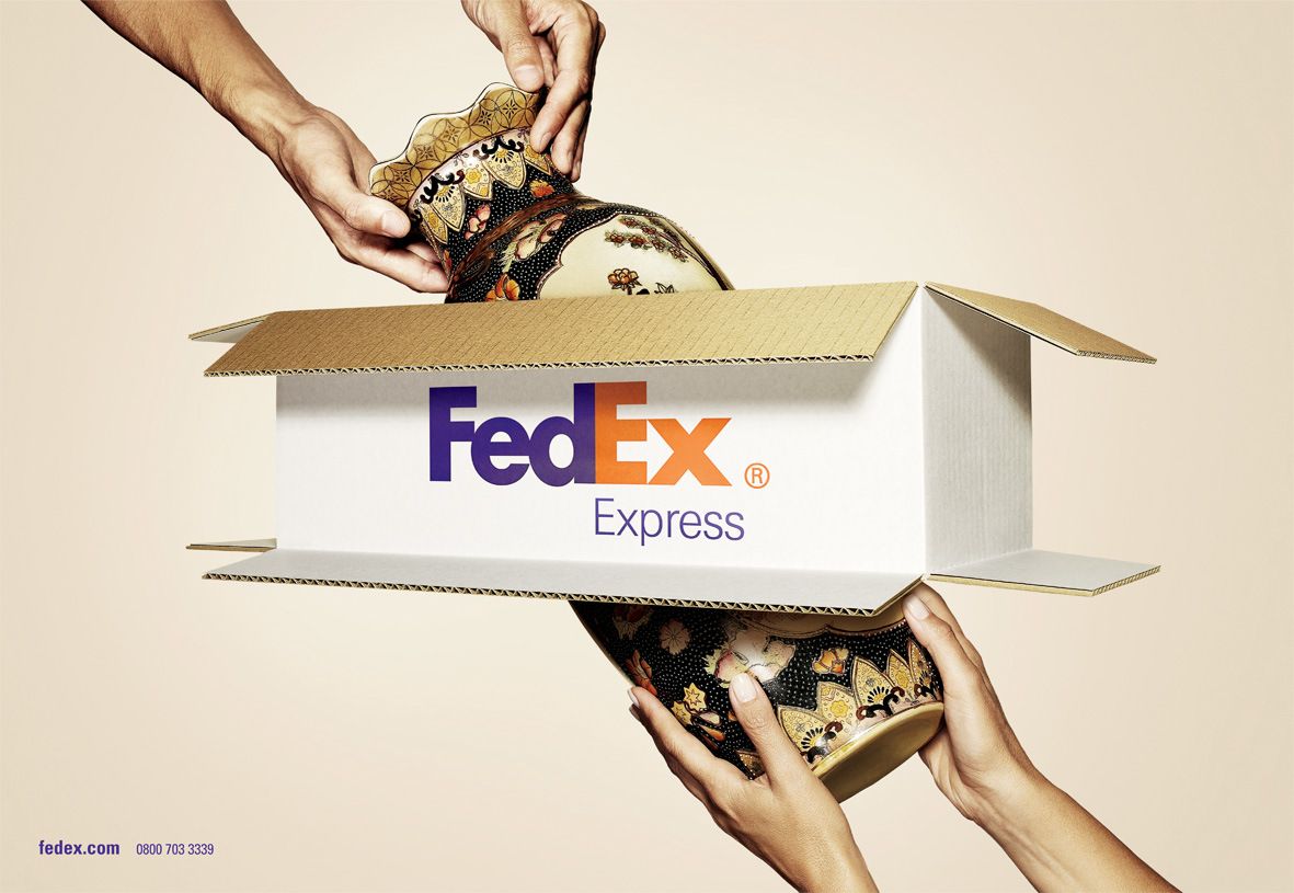 Poster: Vase passing through an open-ended shipping box