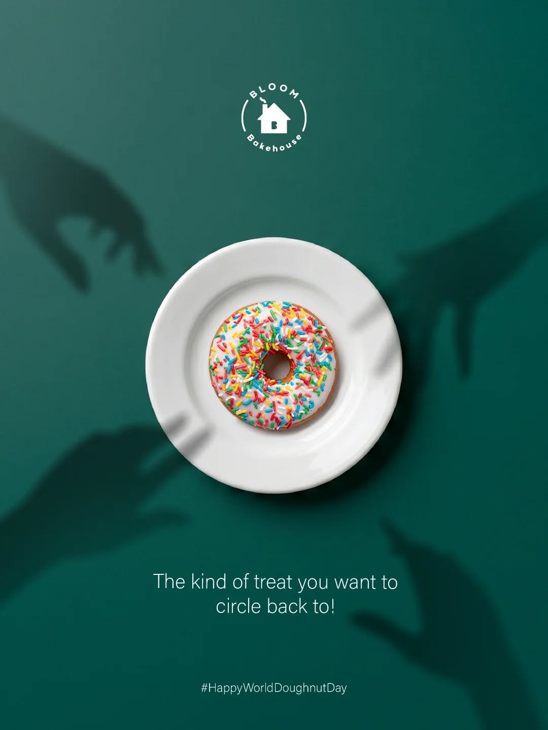 other-festival Instagram post: Sprinkled doughnut on a white plate, with shadow hands reaching for it