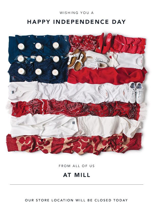 Flat-lay of clothes, shoes and candles arranged as a US flag