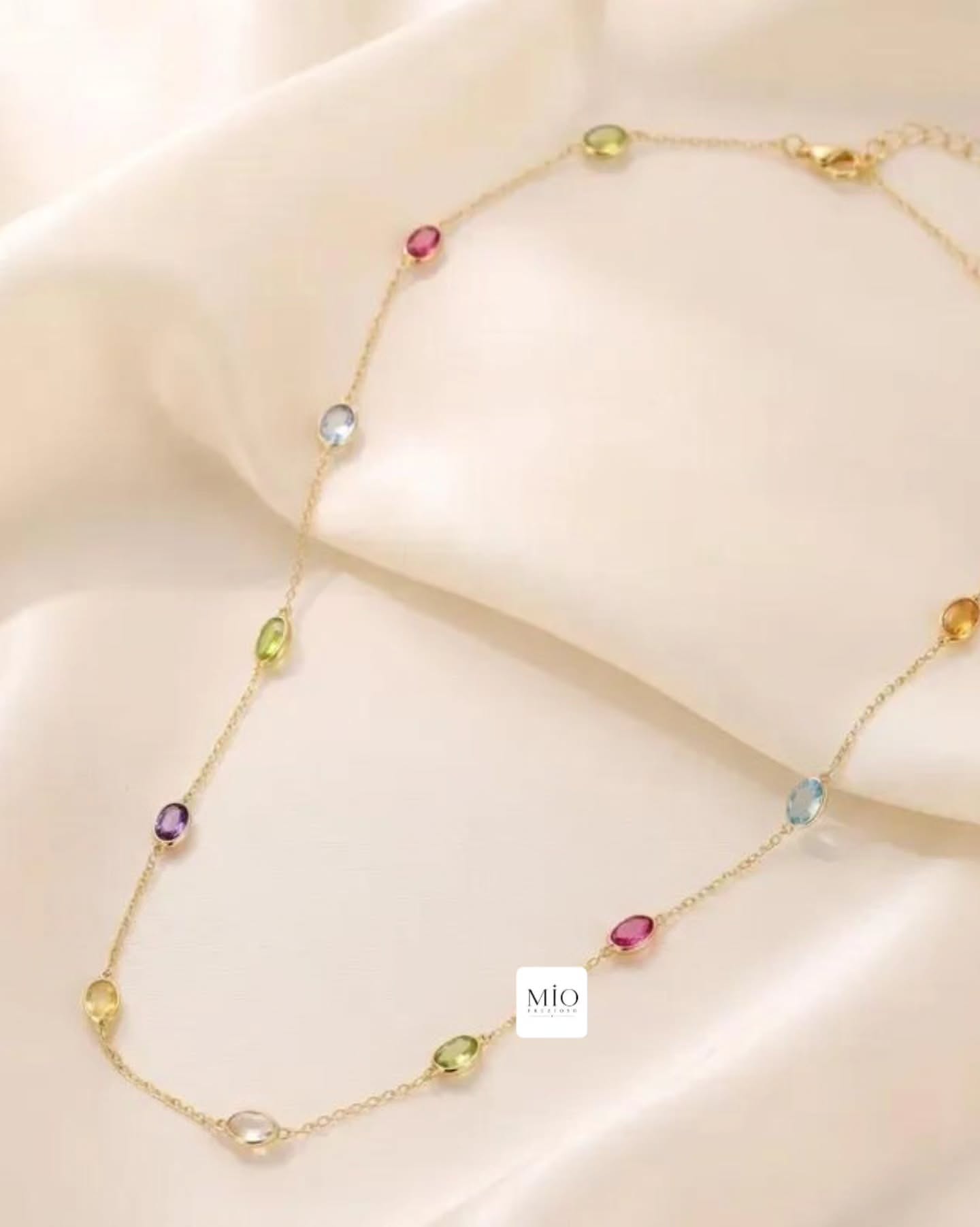Ganesh Chaturthi Carousel: Gemstone station necklace draped across a sculpted copper Ganesha face, slide 2