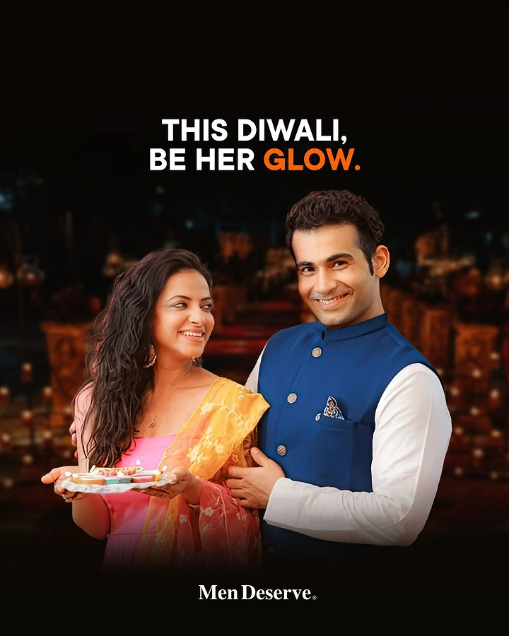 Diwali creative ad: Smiling couple in festive ethnic wear holding a diya thali