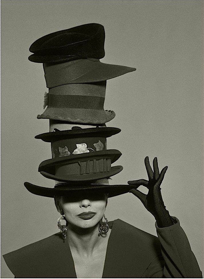 Instagram post: Surreal stacked-hat fashion composition