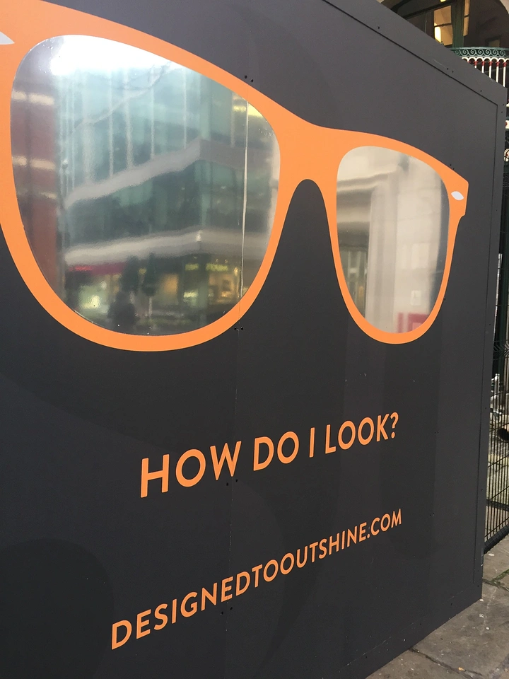Opticians & Eye Care creative ad: Hoarding glasses frame reflective window lenses
