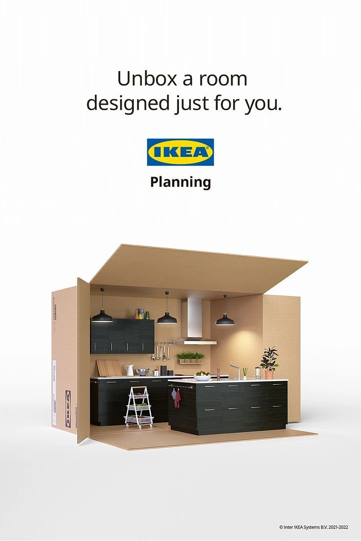 Creative ad: Open cardboard box containing a fully furnished kitchen