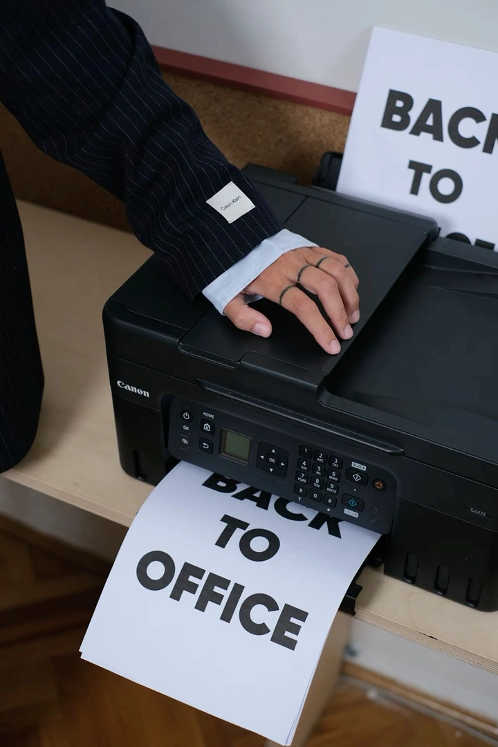 Printing Shops creative ad: Printer outputs Back to Office message