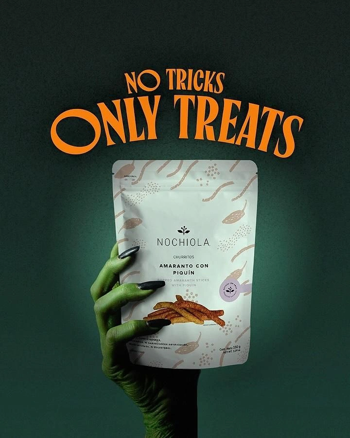 Halloween creative ad: Green witch hand holding a snack pouch