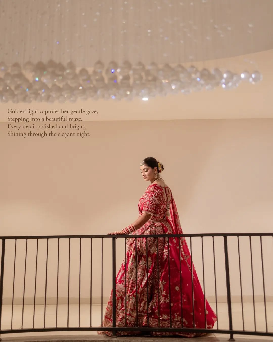 Carousel: Indian bride in crimson veil and ornate traditional jewelry, slide 2