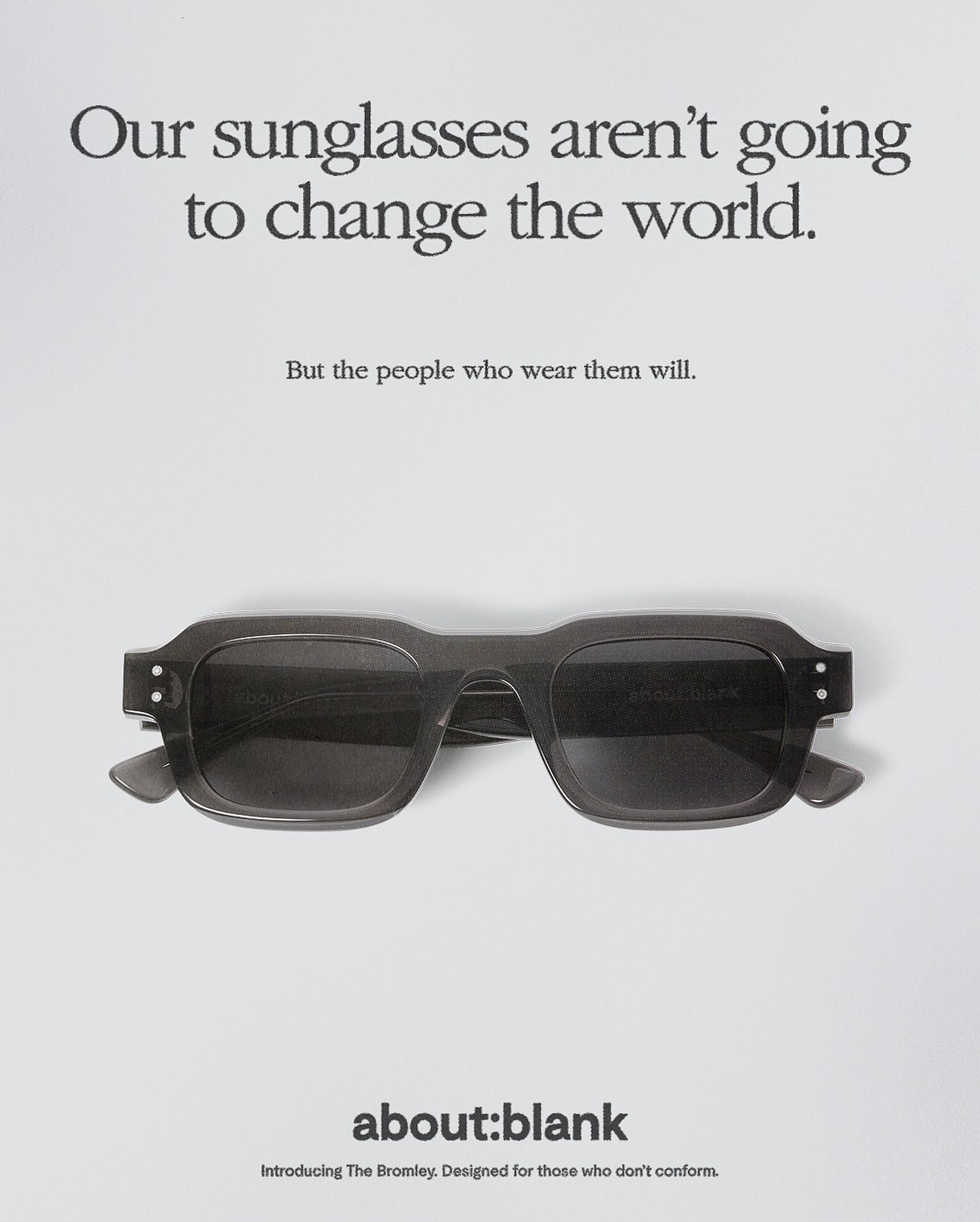 Instagram post: Folded grey translucent sunglasses on pale grey