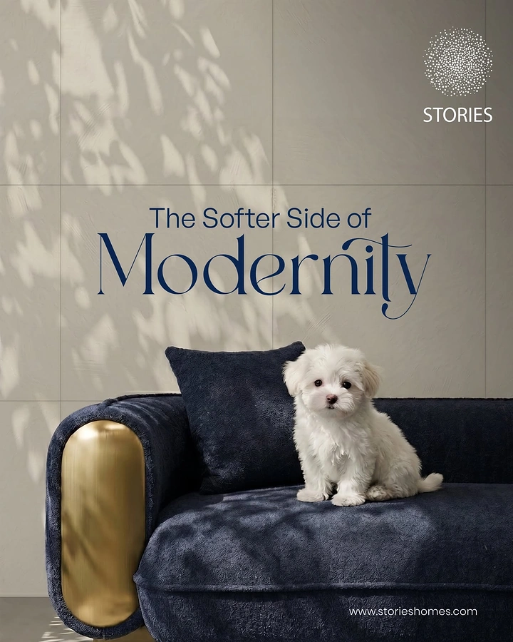 Creative ad: White puppy on navy velvet sofa
