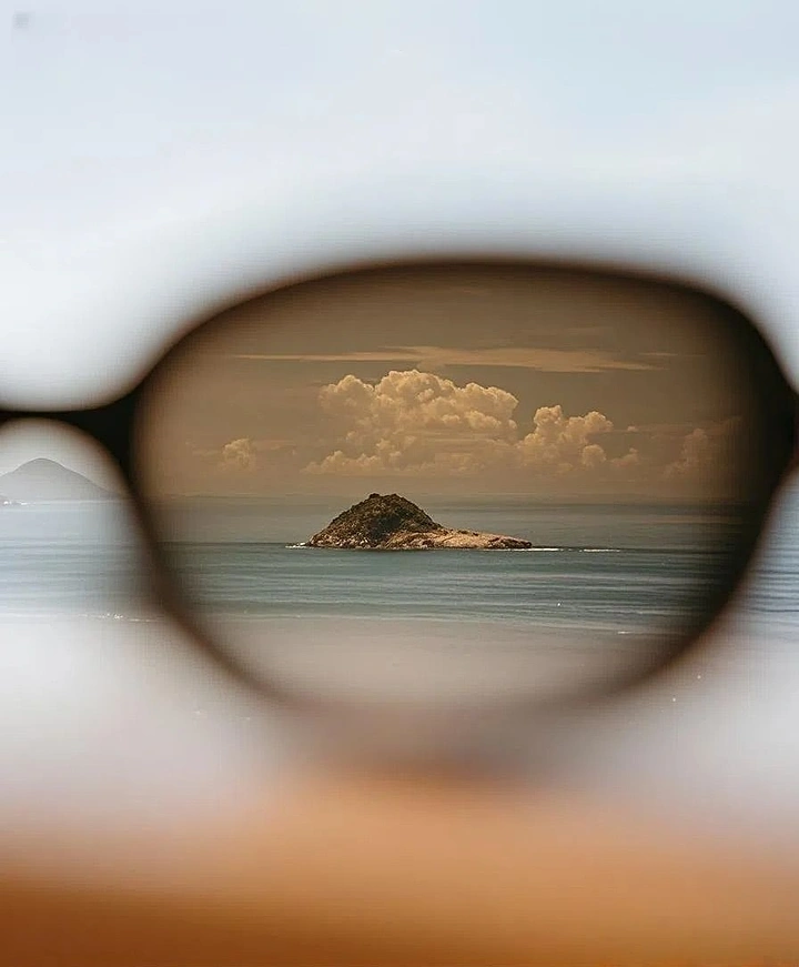Sunglasses Brands creative ad: Island landscape framed through sunglasses