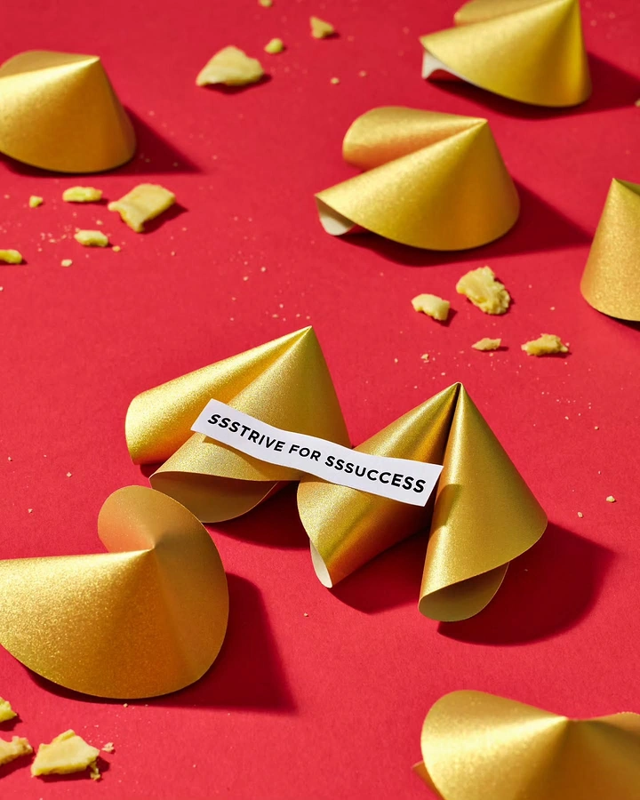 Lunar New Year creative ad: Gold shimmer fortune cookies with a message slip