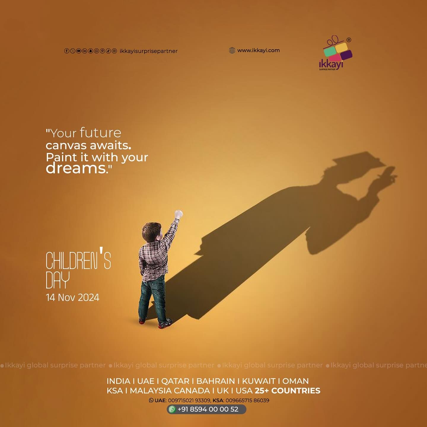 Small boy raising fist casting a long shadow of a graduate in cap and gown