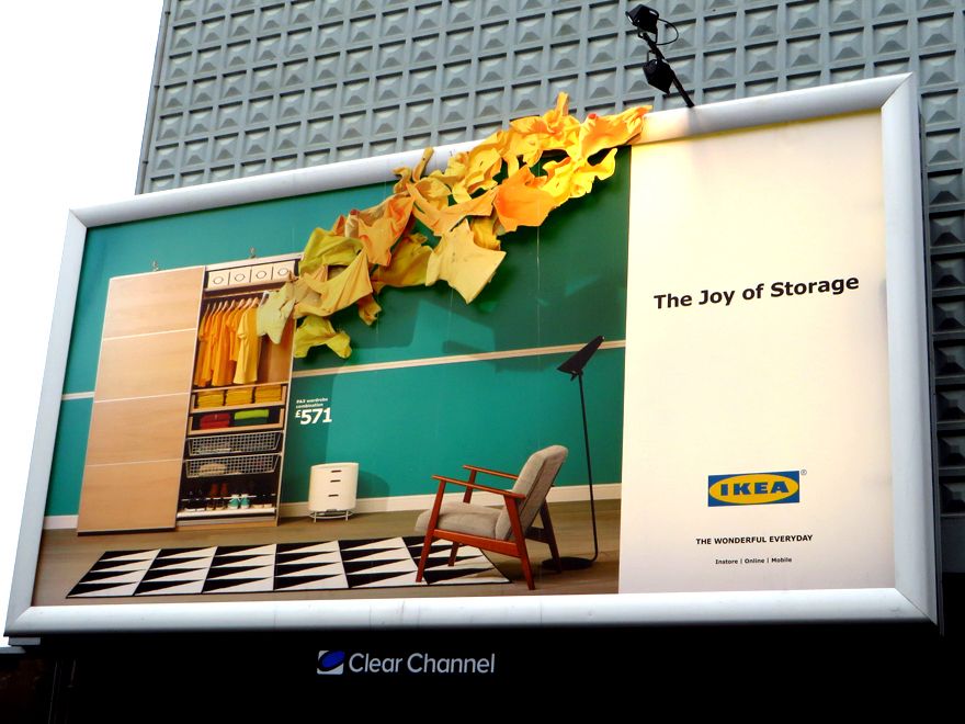 Banner: Open wardrobe with yellow clothes bursting beyond the billboard frame