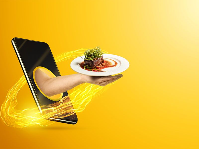 Banner: Hand from phone serves dish