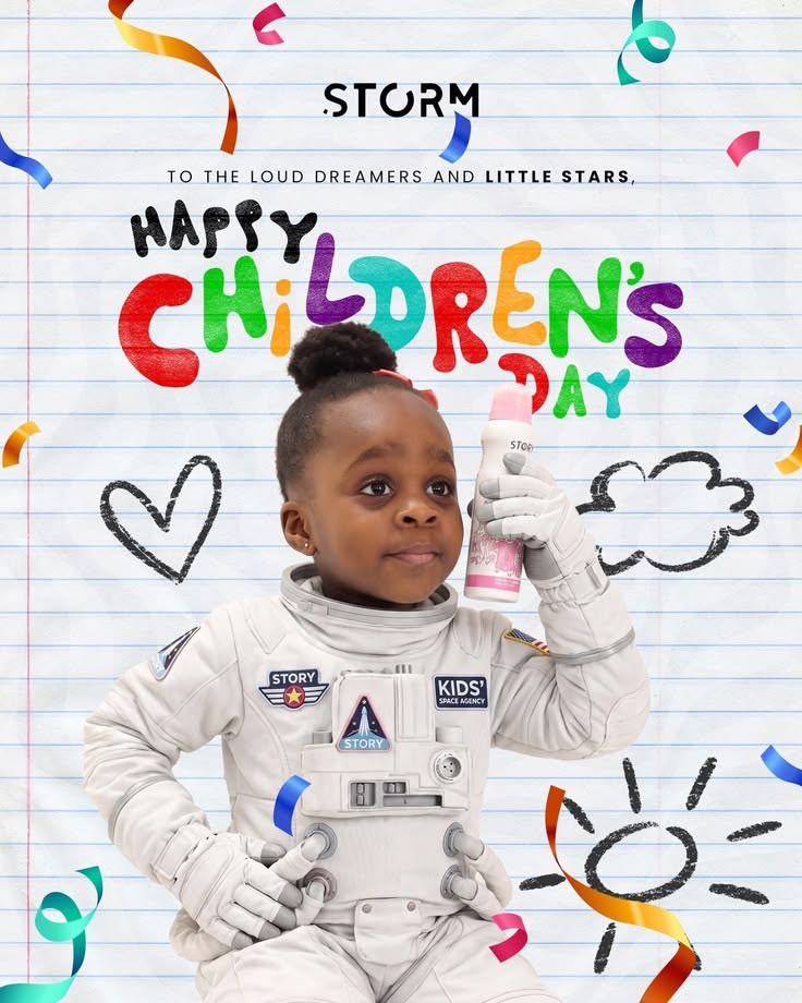 Young girl in astronaut suit holding a product bottle